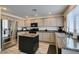 Modern kitchen features granite countertops, stainless appliances, and a functional island at 2787 Fountain Ridge Ln, Henderson, NV 89074