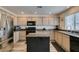Modern kitchen features granite countertops, stainless appliances, and a functional island at 2787 Fountain Ridge Ln, Henderson, NV 89074