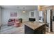 Stylish living room with stainless steel fridge, modern decor, and granite countertops at 2787 Fountain Ridge Ln, Henderson, NV 89074