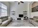 Spacious living room with vaulted ceilings, floating shelves, and contemporary furnishings at 2787 Fountain Ridge Ln, Henderson, NV 89074