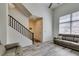 Stylish living room featuring stairs, natural light, and modern sofa arrangement at 2787 Fountain Ridge Ln, Henderson, NV 89074