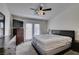 Primary bedroom with a fan, TV, dresser, and access to a private balcony at 2787 Fountain Ridge Ln, Henderson, NV 89074