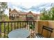 Exterior view of a patio with a table and chair with views of nearby building and landscaping at 2787 Fountain Ridge Ln, Henderson, NV 89074
