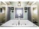 Elegant bathroom showcasing a luxurious soaking tub with a glass encased shower at 3041 Hammerwood Dr, Las Vegas, NV 89135