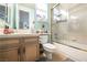 Bright bathroom with beige cabinets and updated shower at 3041 Hammerwood Dr, Las Vegas, NV 89135