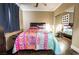 Bedroom features a bed with bright and colorful patterned bedding at 3041 Hammerwood Dr, Las Vegas, NV 89135