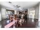 Dining room featuring hardwood floors, a ceiling fan, and a large window at 3041 Hammerwood Dr, Las Vegas, NV 89135