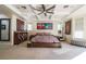 Lovely bedroom with large bed, decorative ceiling and fan, with carpeted floors at 3041 Hammerwood Dr, Las Vegas, NV 89135