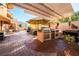 Backyard complete with built-in grill and outdoor kitchen, perfect for entertaining at 3041 Hammerwood Dr, Las Vegas, NV 89135