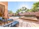 Inviting pool and jacuzzi surrounded by lounge chairs and lush greenery at 3041 Hammerwood Dr, Las Vegas, NV 89135