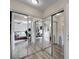 Bedroom view through mirrored closet doors, with hardwood floors and ceiling fan at 3151 Soaring Gulls Dr # 1192, Las Vegas, NV 89128