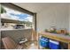 Outdoor patio with seating and table, overlooking parking and neighboring units at 3151 Soaring Gulls Dr # 1192, Las Vegas, NV 89128