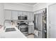 Modern kitchen with stainless steel appliances and white countertops at 367 Lander Dr, Henderson, NV 89074