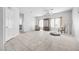 Inviting living room with tile flooring, natural light, and adjacent access to kitchen at 367 Lander Dr, Henderson, NV 89074