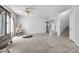 Bright living room with tile flooring, staircase and a view into the front entrance at 367 Lander Dr, Henderson, NV 89074
