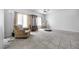 Spacious living room with neutral tile flooring, large windows and comfortable seating at 367 Lander Dr, Henderson, NV 89074