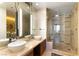 Modern bathroom featuring dual vanities, a glass-enclosed shower, and stylish fixtures at 3722 Las Vegas Blvd # 1908, Las Vegas, NV 89158