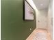 Inviting hallway features a green accent wall and modern art at 3722 Las Vegas Blvd # 1908, Las Vegas, NV 89158