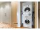 Convenient laundry area with a stacked washer and dryer and built-in storage at 3722 Las Vegas Blvd # 1908, Las Vegas, NV 89158