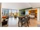 Open living space with a bar table, chairs, and views of the Las Vegas skyline at 3722 Las Vegas Blvd # 1908, Las Vegas, NV 89158