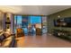Modern living room with a leather sofa and expansive windows overlooking the Las Vegas skyline at 3722 Las Vegas Blvd # 1908, Las Vegas, NV 89158
