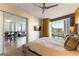 Bright main bedroom featuring a ceiling fan, city views, and sliding door access to the living area at 3722 Las Vegas Blvd # 1908, Las Vegas, NV 89158