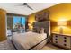 Cozy bedroom featuring a tufted headboard, city views, and stylish nightstands at 3722 Las Vegas Blvd # 1908, Las Vegas, NV 89158