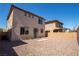 Large, low-maintenance backyard with rock landscaping, brick patio and block wall at 386 Espressivo St, Henderson, NV 89011