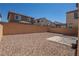 Low-maintenance backyard featuring rock landscaping, a brick wall, and sunny exposure at 386 Espressivo St, Henderson, NV 89011