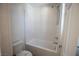 Clean bathroom featuring a shower-tub combo with white tile and modern fixtures at 386 Espressivo St, Henderson, NV 89011