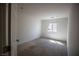 Empty bedroom with carpet, small window, and natural light at 386 Espressivo St, Henderson, NV 89011
