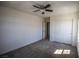 Bright bedroom featuring carpet, ceiling fan and a closet for storage at 386 Espressivo St, Henderson, NV 89011