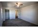 Bedroom featuring carpet, ceiling fan, closet and bright, natural light at 386 Espressivo St, Henderson, NV 89011