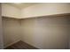 Empty walk-in closet with rod and shelf at 386 Espressivo St, Henderson, NV 89011