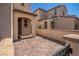 Courtyard entrance to home with covered walkway and brick pavers at 386 Espressivo St, Henderson, NV 89011