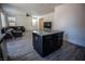 Kitchen island offers additional counter space to the open concept living room at 386 Espressivo St, Henderson, NV 89011