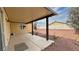 Backyard view with a covered patio and landscaping at 3938 E Chaffe Ave, Pahrump, NV 89061