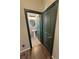 View of a half bath with a pedestal sink and gray tiled walls at 3938 E Chaffe Ave, Pahrump, NV 89061