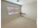 Bedroom with neutral carpet, a floating desk, and window providing ample natural light at 3938 E Chaffe Ave, Pahrump, NV 89061
