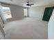 Neutral bedroom featuring a ceiling fan and neighborhood views at 3938 E Chaffe Ave, Pahrump, NV 89061
