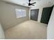 Neutral bedroom featuring a ceiling fan, window and closet at 3938 E Chaffe Ave, Pahrump, NV 89061