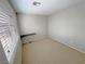 Bedroom with neutral carpet, a floating desk, and bright window with natural light at 3938 E Chaffe Ave, Pahrump, NV 89061