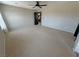 Neutral bedroom featuring a ceiling fan and ensuite bath at 3938 E Chaffe Ave, Pahrump, NV 89061