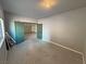A versatile bonus room with epoxy flooring and a view to the garage at 3938 E Chaffe Ave, Pahrump, NV 89061