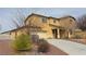 Charming two-story home featuring a desert landscape, neutral stucco, and attached two car garage at 3938 E Chaffe Ave, Pahrump, NV 89061
