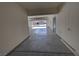 View from garage to exterior, showcasing epoxy flooring and access to street at 3938 E Chaffe Ave, Pahrump, NV 89061