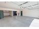 Large two-car garage with epoxy flooring, storage racks, and access to the home at 3938 E Chaffe Ave, Pahrump, NV 89061