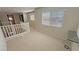 Upstairs hallway with a view of the staircase, multiple rooms, and natural light at 3938 E Chaffe Ave, Pahrump, NV 89061