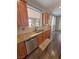 Kitchen with granite counters, stainless appliances, wood cabinets, backsplash and undermount sink at 3938 E Chaffe Ave, Pahrump, NV 89061