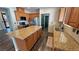 Kitchen with granite counters, stainless appliances, cabinets, and large island at 3938 E Chaffe Ave, Pahrump, NV 89061